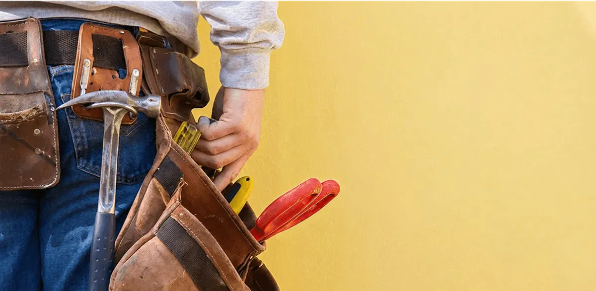 Handyman with tool belt ready for home repairs and maintenance in Allentown, PA